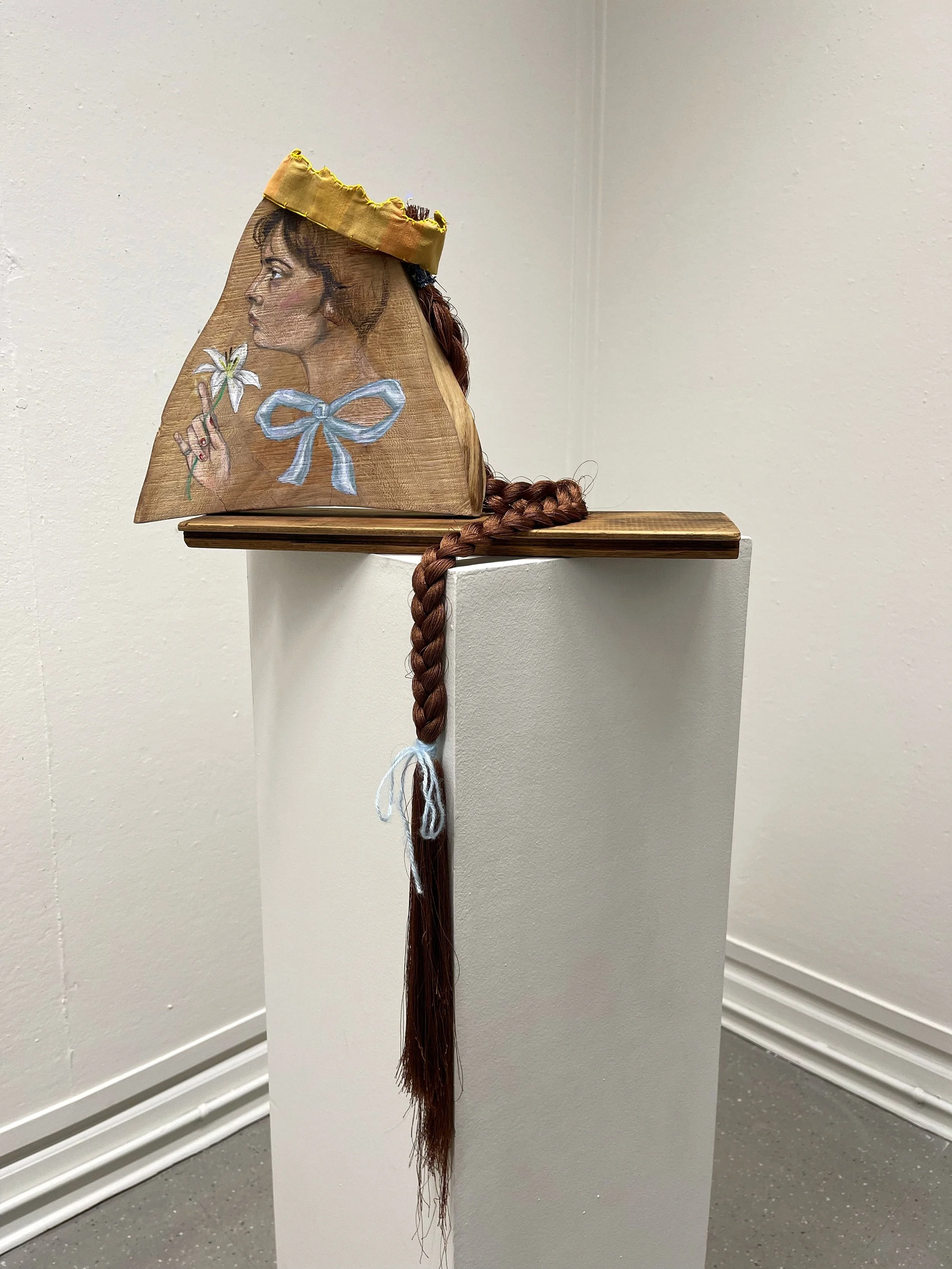 Crowned Wood, 2023.
Acrylic paint and pencil on found wood, braided yarn and fabric crown.